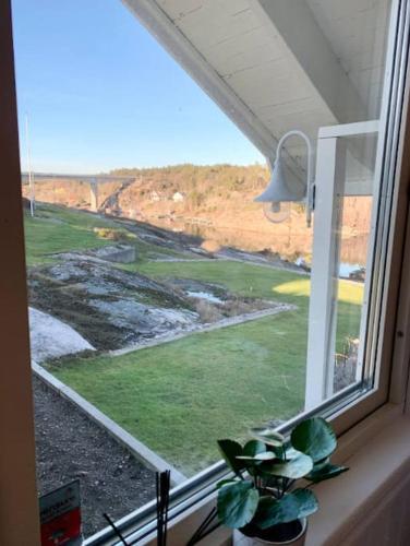 a window with a view of a golf course at SeaSide in Hjälteby