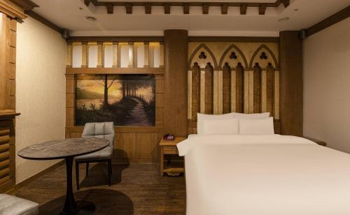 Llit o llits en una habitació de Doksan 3S Hotel