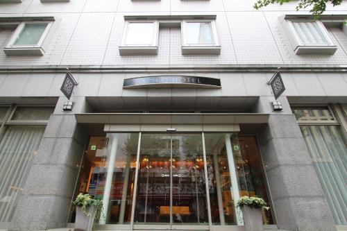 a store front of a building with glass doors at KOKO HOTEL Sendai Station West in Sendai