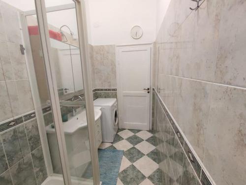 a bathroom with a toilet and a sink and a mirror at Lucia appartamento uso esclusivo - Aeroporto Genova Sestri Ponente in Genoa
