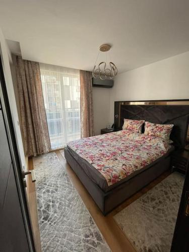 a bedroom with a bed and a window at Luxury Flat-4 People-Mladost in Varna City