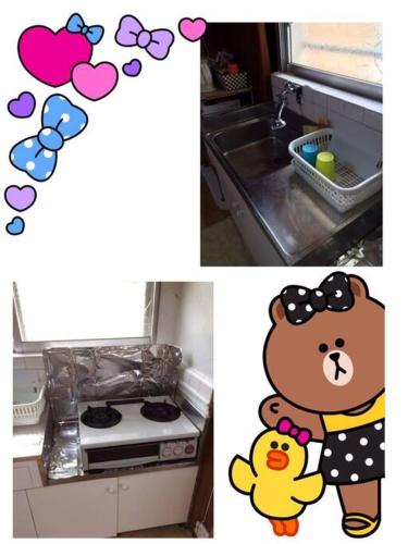 a kitchen with a sink and a teddy bear and a stove at 【MEMS】1人から貸切OK!駐車場1台付き!那覇空港から車で13分！ in Takara