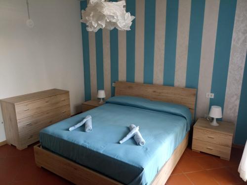 Postel nebo postele na pokoji v ubytování La casetta del panda