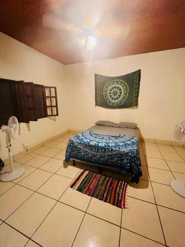 a bedroom with a bed and a rug on the floor at Around JSM Granada in Granada