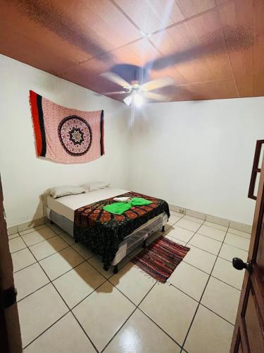 a bedroom with a bed in the corner of a room at Around JSM Granada in Granada