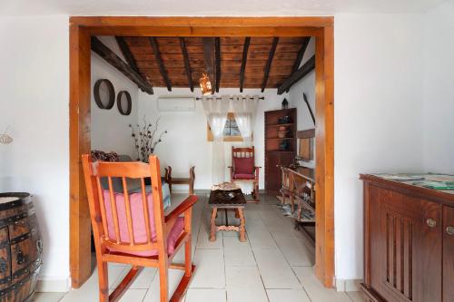 a room with a chair and a table in it at Casa Rural Medina 1 in Agulo