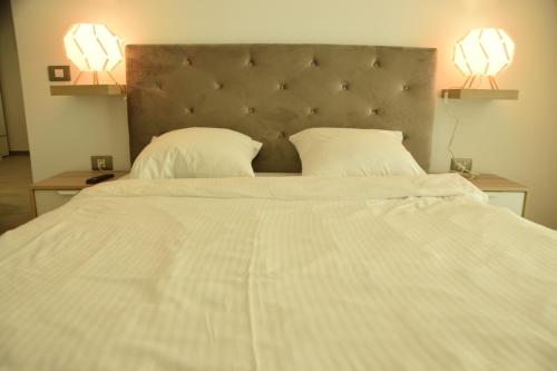 En eller flere senge i et værelse på Apartament Willow by the Sea by Alz