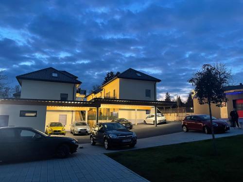 a group of cars parked in a parking lot at Sorinas Home WB16 Top 4 in Berndorf