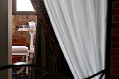 a view of a room with a table and a window at Agriturismo Ma Che Bel Castello in Mombaruzzo