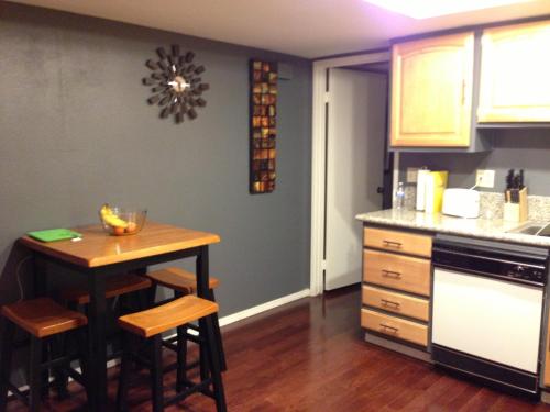 a kitchen with a small table and a counter at Desert Getaway in Desert Hot Springs