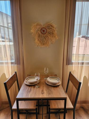 a dining room table with two chairs and a chandelier at Karaköy in Karaköy Hotel in Istanbul