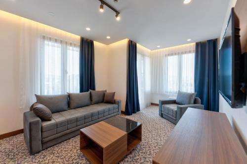a living room with a couch and a coffee table at Queen of Zlatibor in Zlatibor