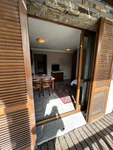 a room with a table and a dining room at Chalet Edelweiss - Estella Hotel Collection in Sestriere