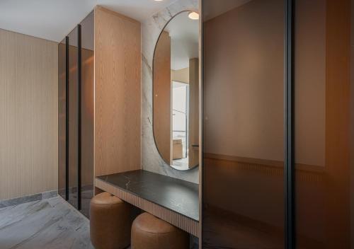 a dressing room with a mirror and a table at JOUDYAN Red Sea Mall Jeddah By ELAF in Jeddah