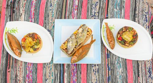 three plates of food on a table at Palm Valley camp in Nuweiba‘ el Muzeinah