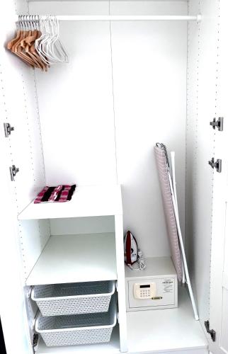 a closet with white shelves and a appliance in it at В7 НОВАЯ КВАРТИРА ВАТСАП669З582I976 можно РУБЛЯМИ in Nai Yang Beach