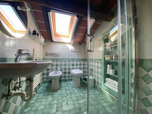 a bathroom with a sink and a toilet at La Torretta, Decameron View, sweet apartment in Certaldo