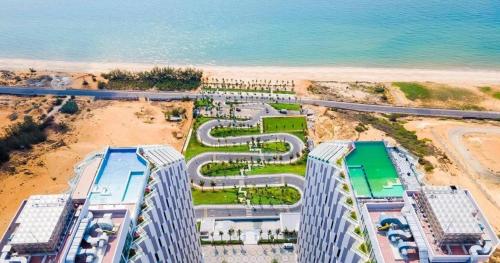 an overhead view of a building on the beach at Apec Mandala Cham Bay Condotel Mui Ne in Mui Ne