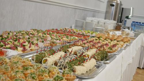 a buffet line of sandwiches and other foods on trays at Restauracja Kargul noclegi in Łęczyca