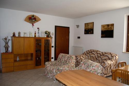 a living room with a couch and a table at Residenza Il Conte in Nocera Umbra