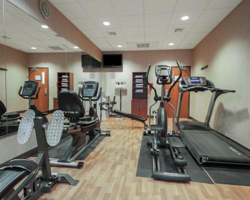 a gym with several treadmills and exercise bikes at MainStay Suites Hobbs in Hobbs