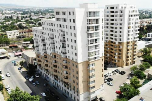 an aerial view of two tall buildings in a city at Tbilisi cozy appartment in Tbilisi City