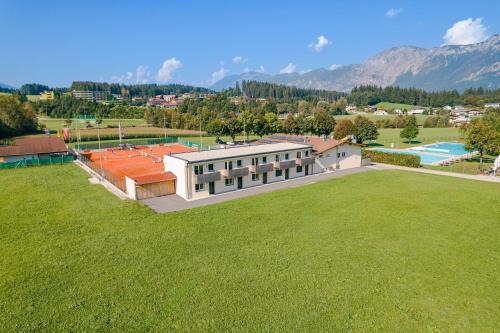 an overhead view of a building with a large grass field at Natur Residenz Bad Häring in Bad Häring