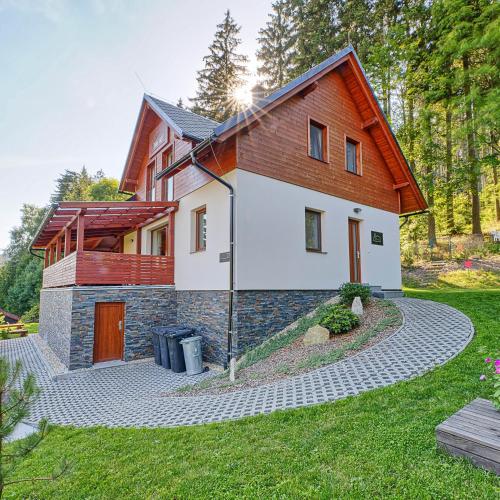 a house with a stone path in front of it at Wellness Chalupa Horní Orlice in Králíky