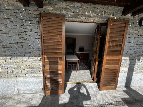 a shadow of a person standing in a doorway at Chalet Edelweiss - Estella Hotel Collection in Sestriere