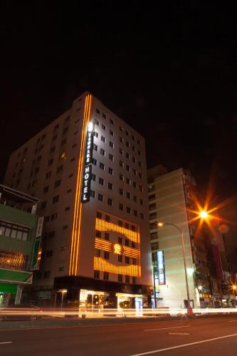 a building with a sign on it at night at YUAI FU HAO Hotel in Taichung