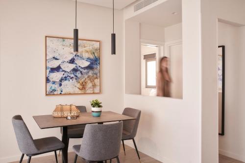 a dining room with a table and chairs at Hestia - Romvis 9 in Athens