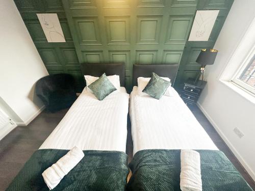 Ένα ή περισσότερα κρεβάτια σε δωμάτιο στο The Valley Inn Liverpool