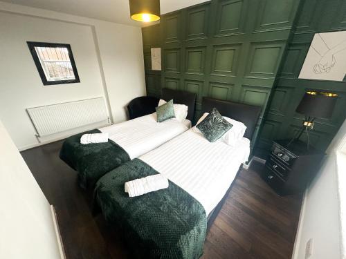 Ένα ή περισσότερα κρεβάτια σε δωμάτιο στο The Valley Inn Liverpool