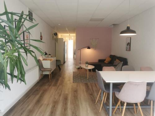 a living room with a table and chairs at Yerseke Maarten & Hanh in Yerseke
