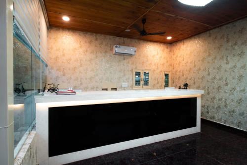 a kitchen with a large counter in a room at Shivjot Farm & Resort Panchkula in Panchkula