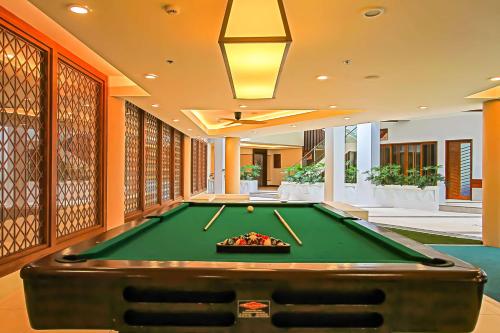 a pool table in the middle of a room at Best Western Plus The Ivywall Resort-Panglao in Panglao Island