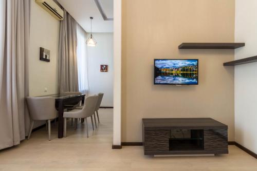 Телевизор и/или развлекательный центр в Central Apartments Maidan Area