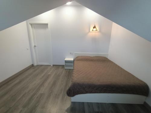 Ένα ή περισσότερα κρεβάτια σε δωμάτιο στο Apartments Bis House