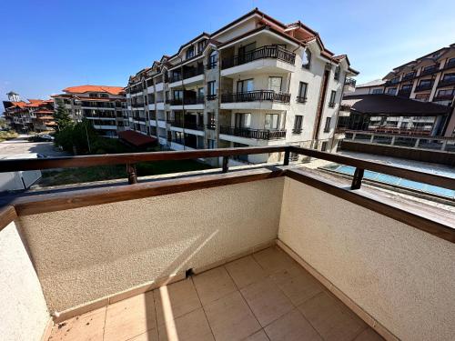 a balcony with a view of a building at White Wood Lodge in Bansko