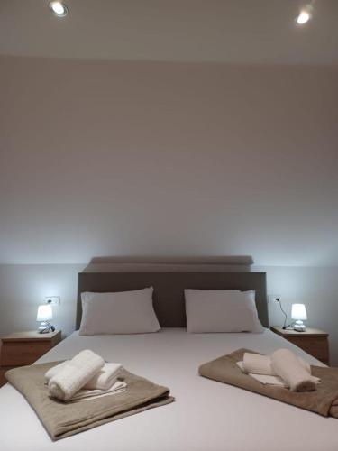 מיטה או מיטות בחדר ב-Katarina