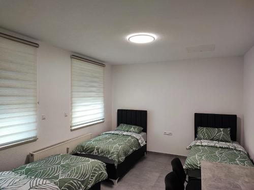 Ένα ή περισσότερα κρεβάτια σε δωμάτιο στο Heidenheimer Zimmer