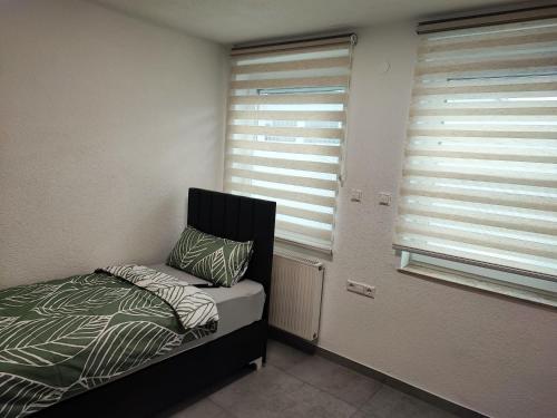 Ένα ή περισσότερα κρεβάτια σε δωμάτιο στο Heidenheimer Zimmer