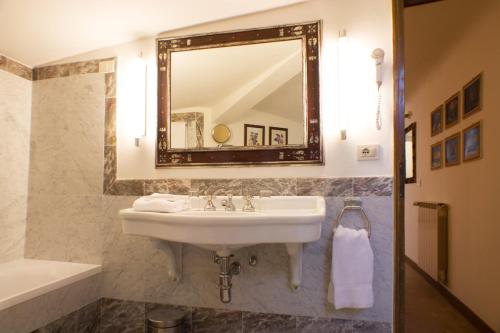 a bathroom with a sink and a mirror at Park Palace Hotel in Florence