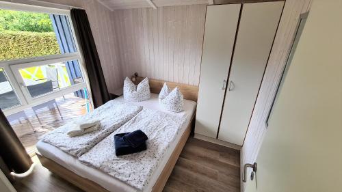 Ένα ή περισσότερα κρεβάτια σε δωμάτιο στο Ferienhaus Strandpark 7