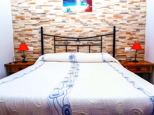 Ένα ή περισσότερα κρεβάτια σε δωμάτιο στο Chalet Piscina Privada Zona Vallada con Barbacoa