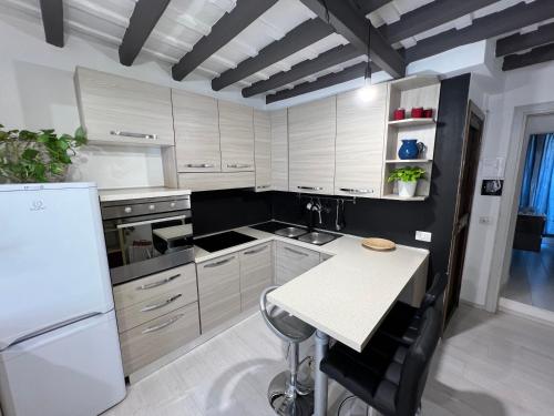 a kitchen with white appliances and a white refrigerator at Charming Navona in Rome