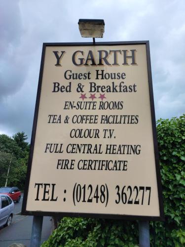 a sign for a guest house bed and breakfast at Y Garth Guesthouse in Bangor