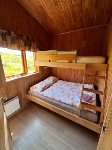 Una cama o camas en una habitación de Hálsabol Sumarhús- with hot tube