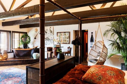a room with a bed and a hammock in it at Bomans Hotell i Trosa in Trosa