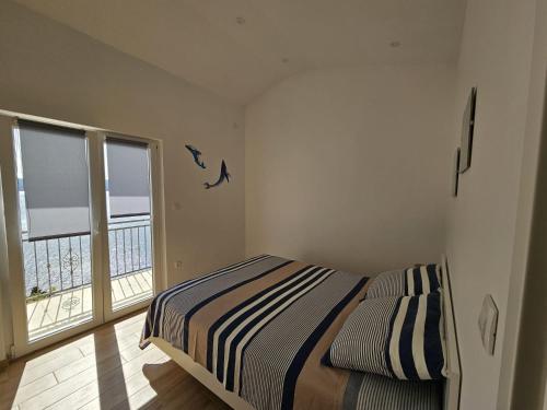 Posteľ alebo postele v izbe v ubytovaní Sea view Apartment